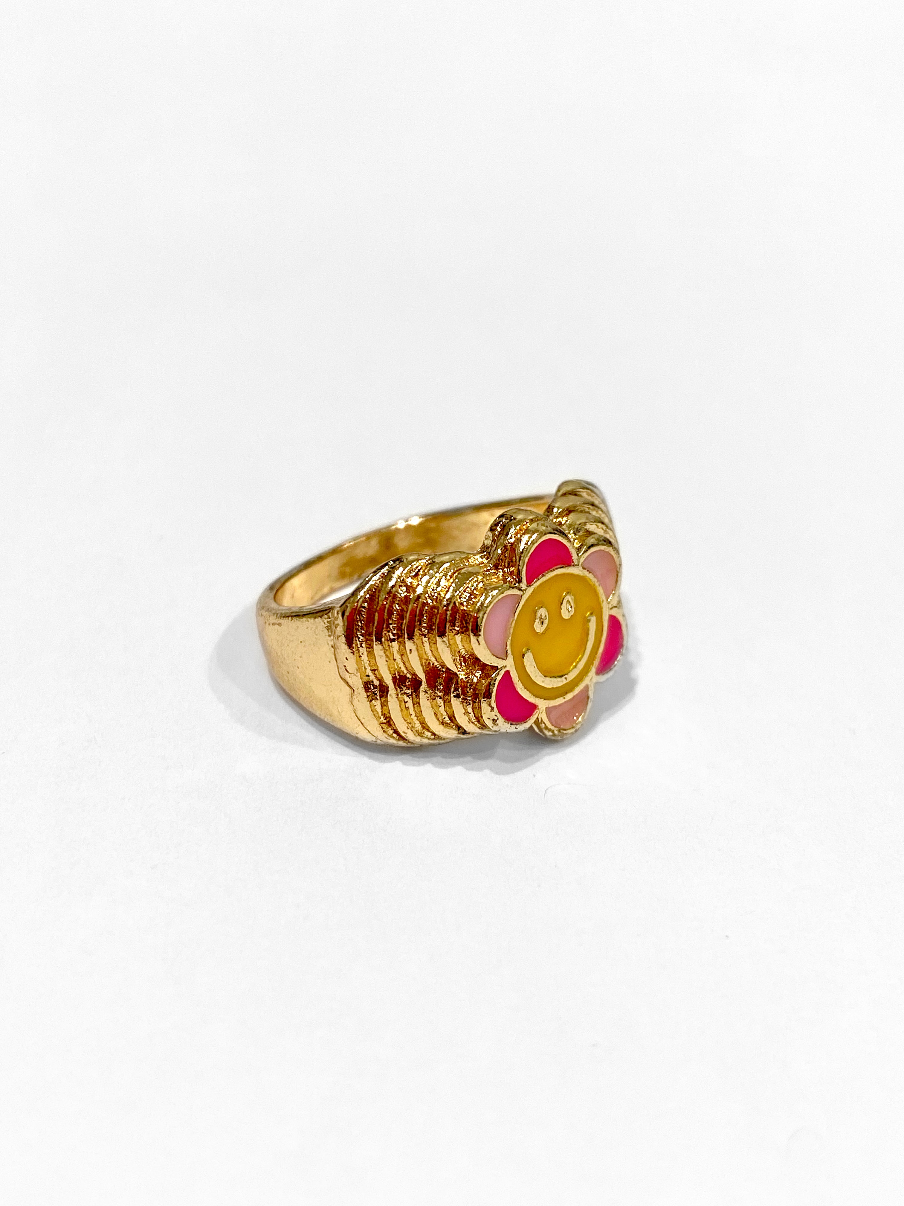 gold pink and yellow spring or summer jewelry with a smiley face and a cute flower